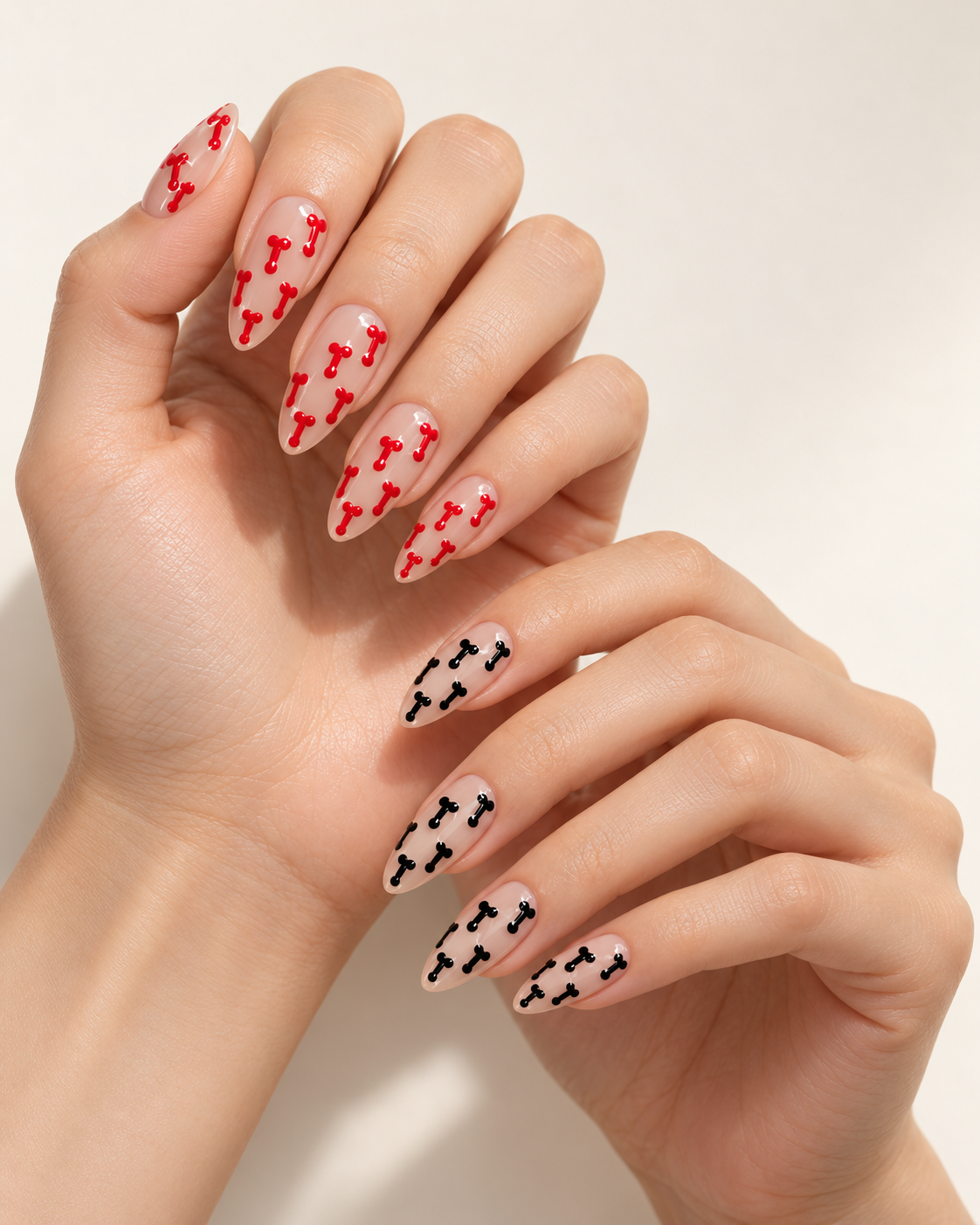 STARE Cherry and Midnight press-on nails worn in a split-hand look