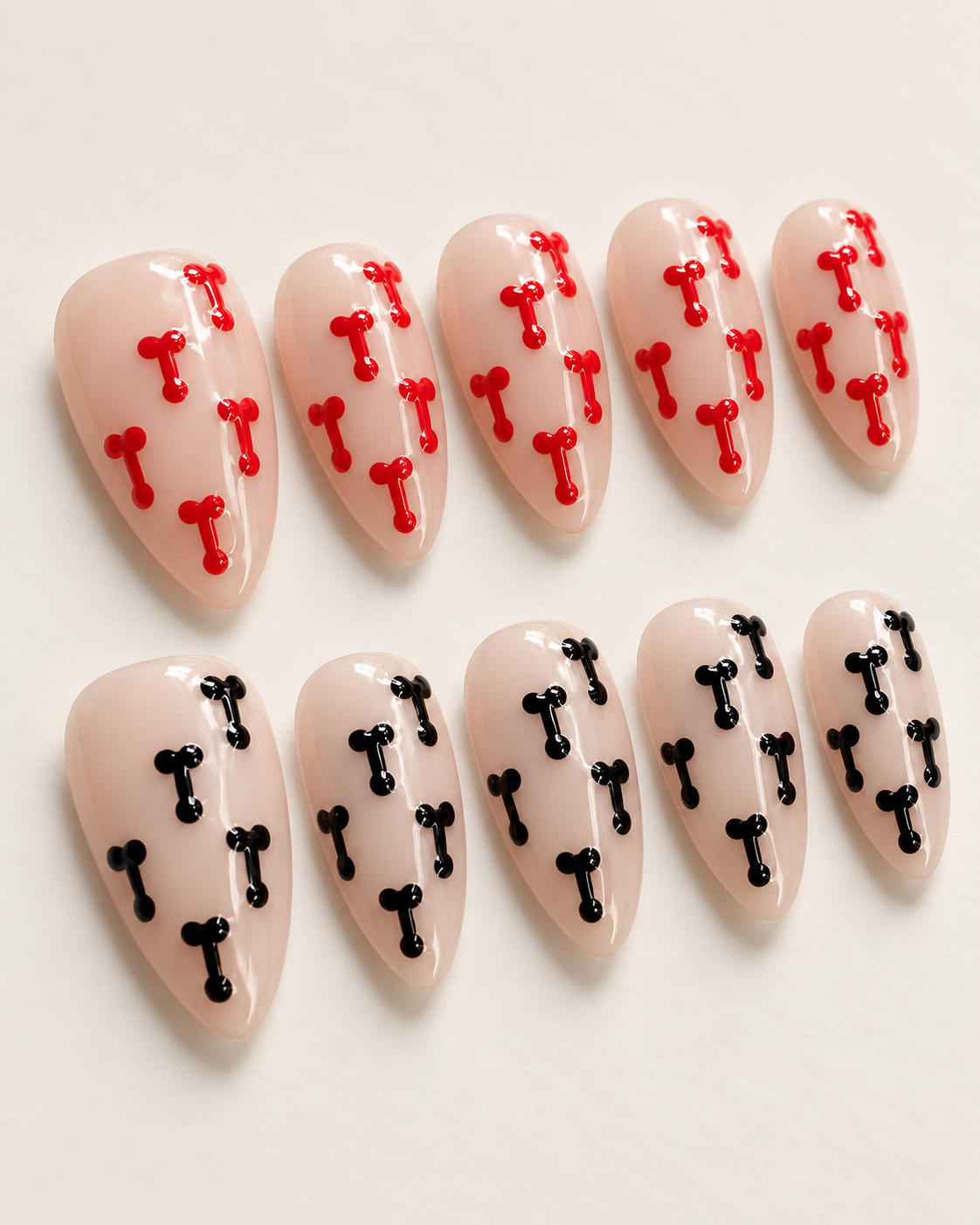 Side-angle studio view of the STARE Cherry and Midnight press-on nail set